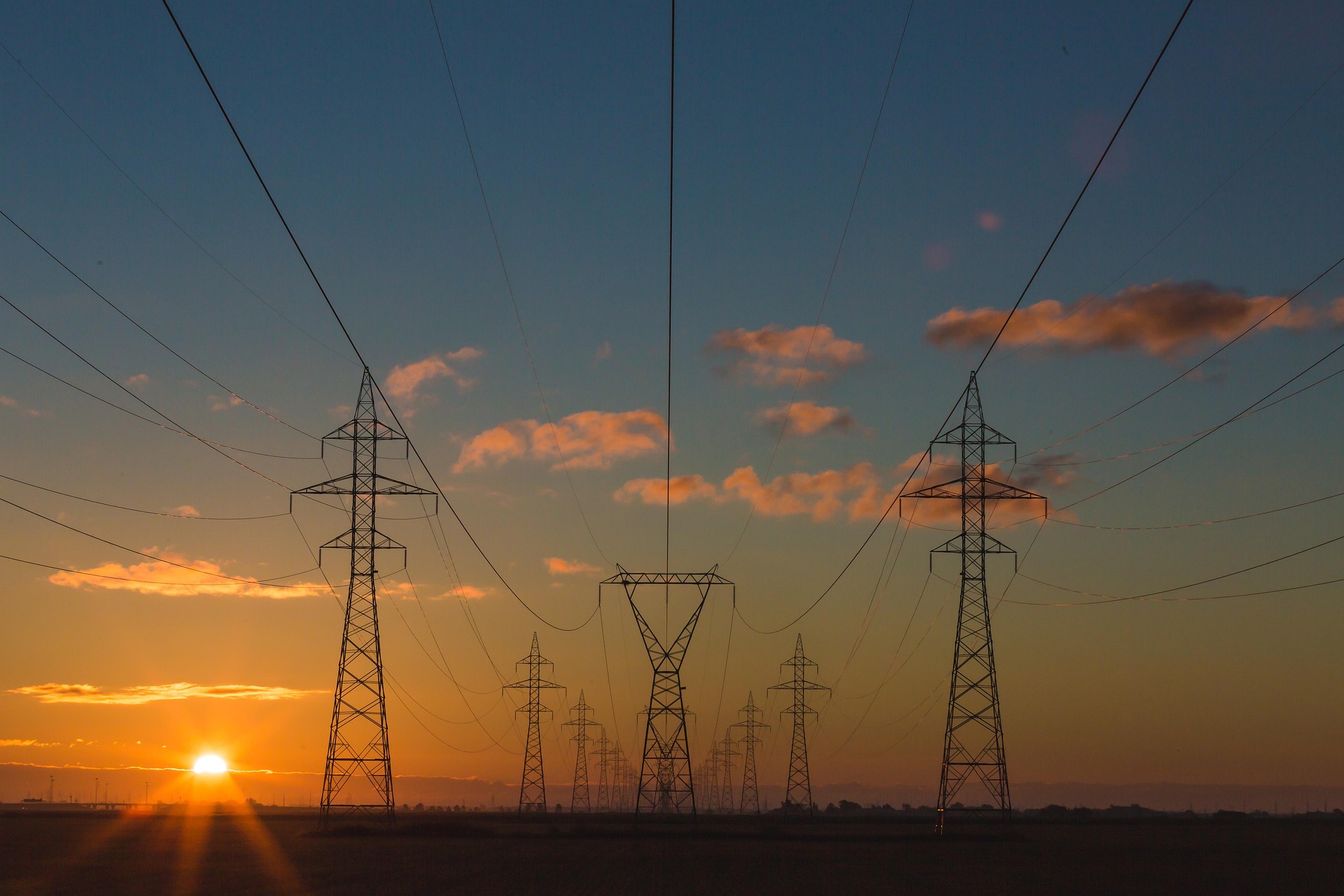 Transmission towers at sunset